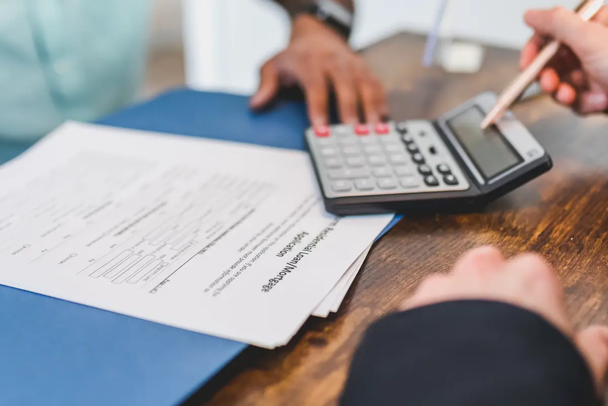 Delving into the history of the real estate code of ethics. The code of ethics is being upheld by real estate agents. Real estate agent looking at exclusive brokerage relationship agreements.