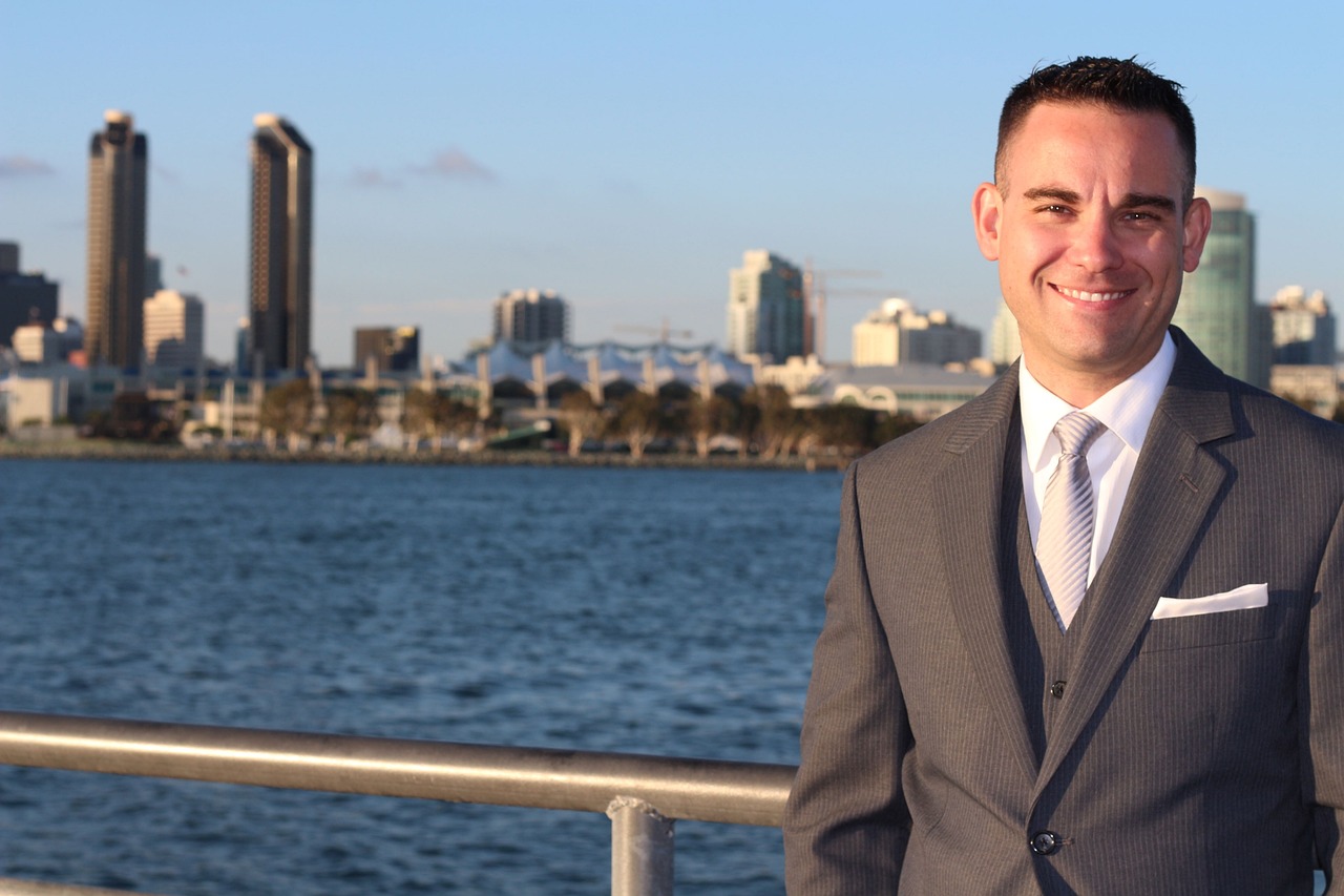 Real estate agent in front of water side properties