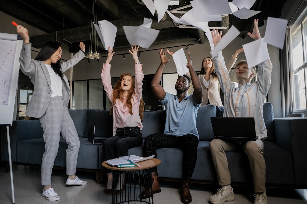 People celebrating after passing their real estate license.