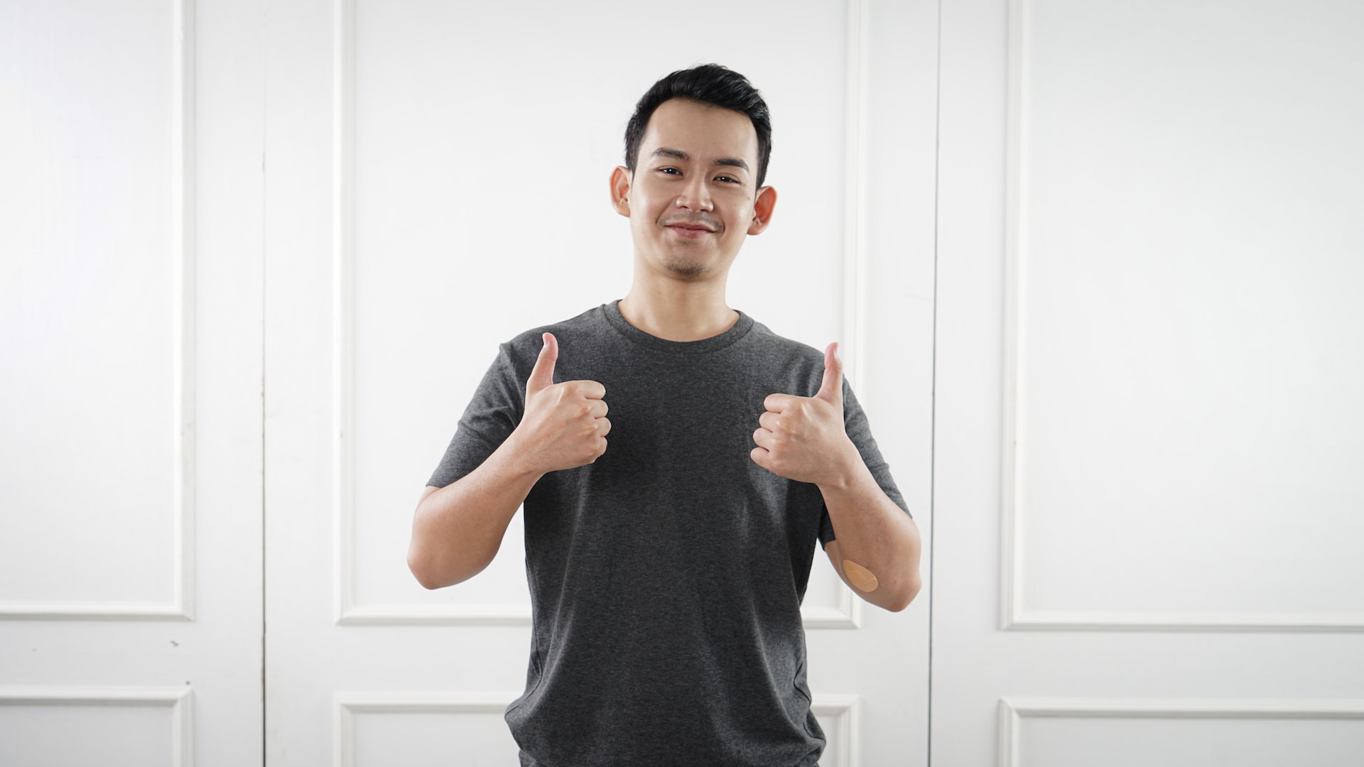 Man giving thumbs up to camera