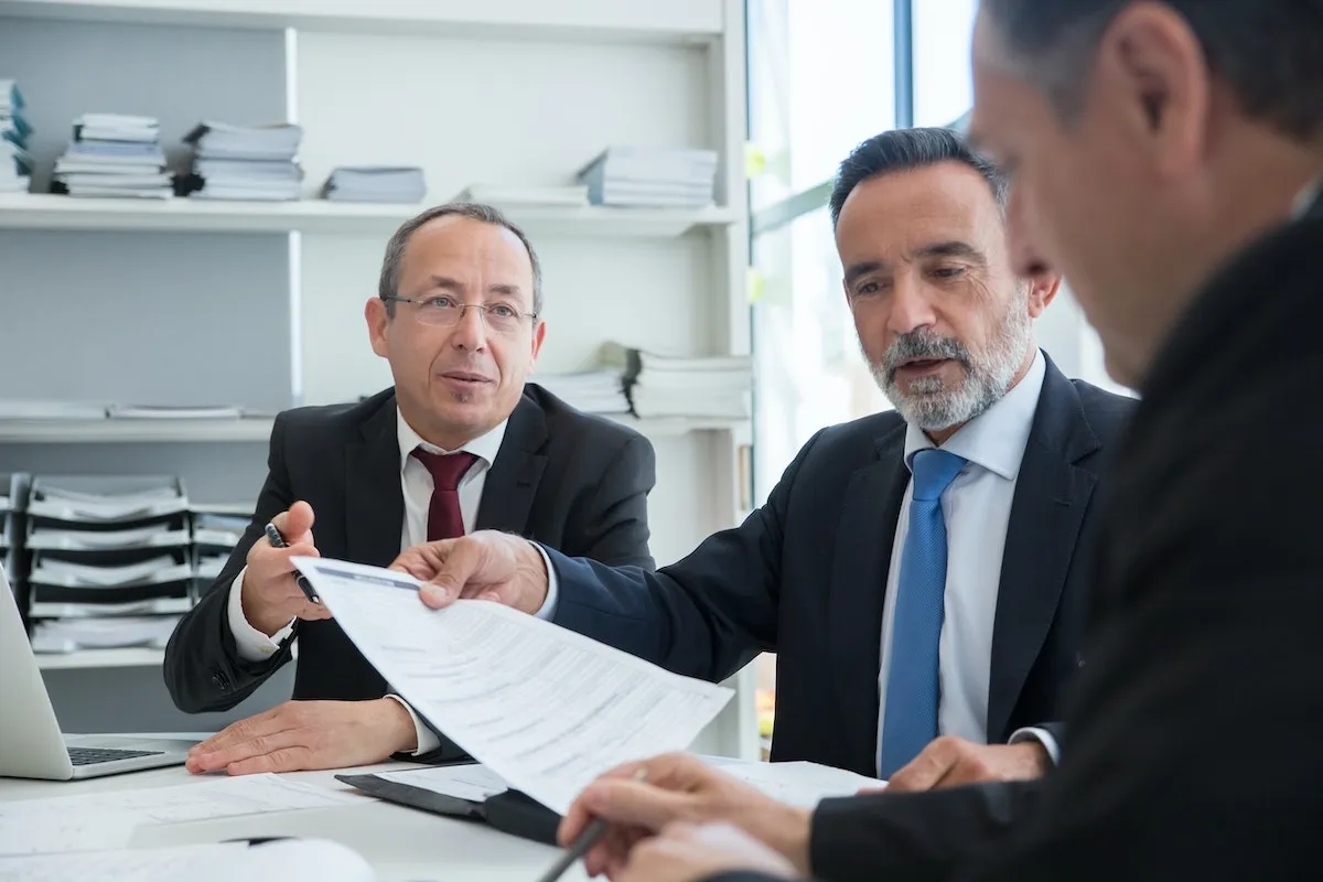 Real estate agents discussing their next critical steps.