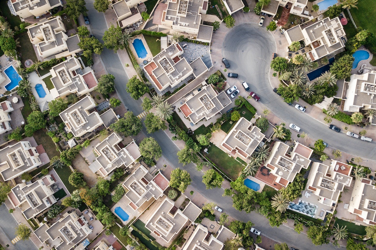Top-down view of houses in a neighborhood.