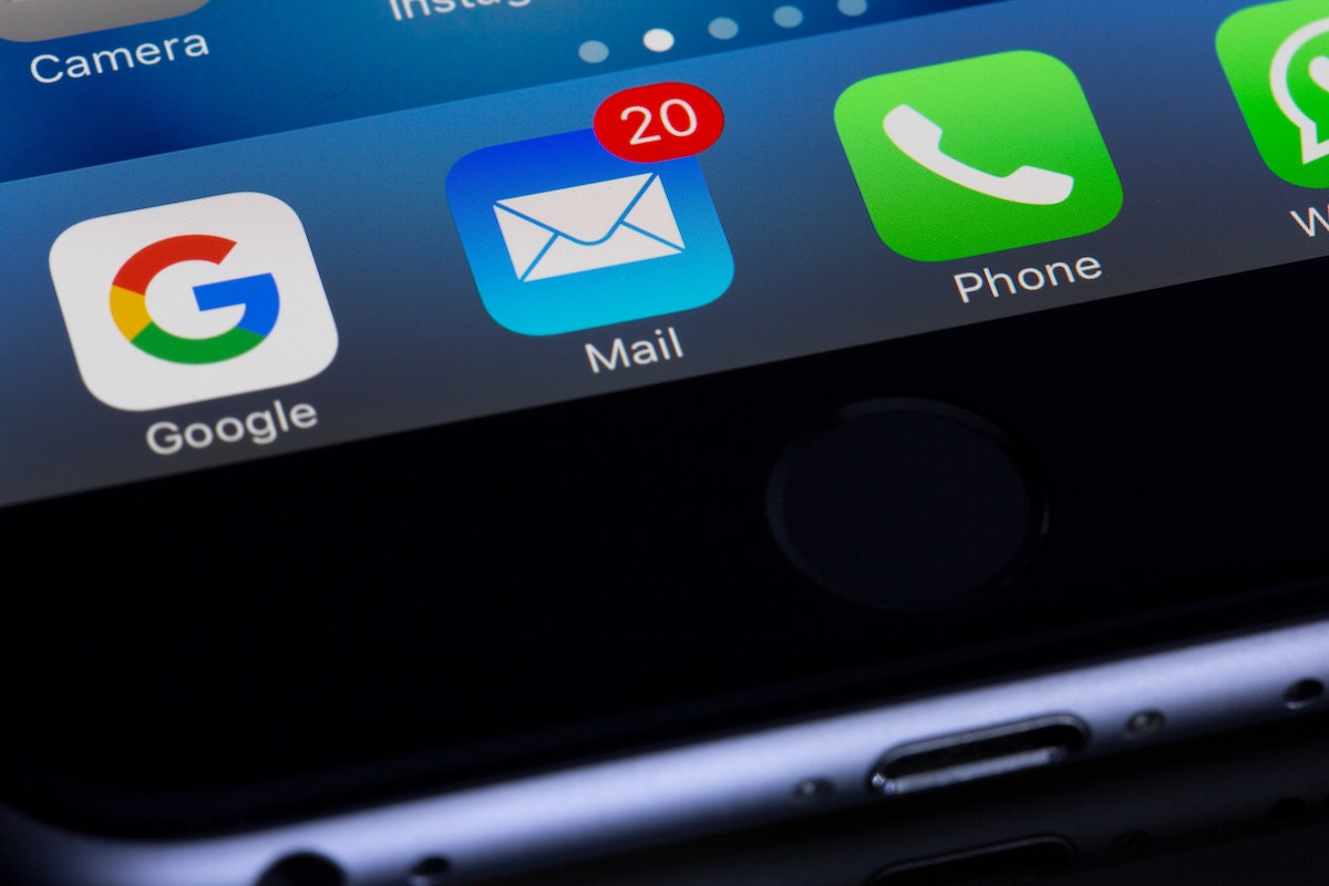 Email marketing apps on a phone screen.