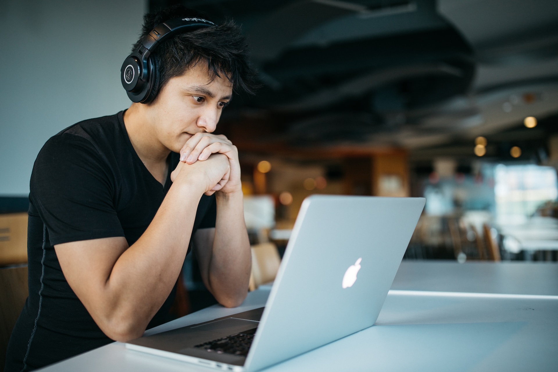 Man listening to a program from a real estate coaching company.