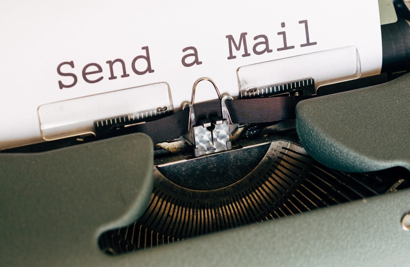 Typewriter with a piece of paper saying Send a Mail.