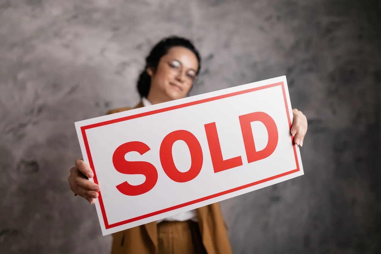 Woman Holding a Signboard