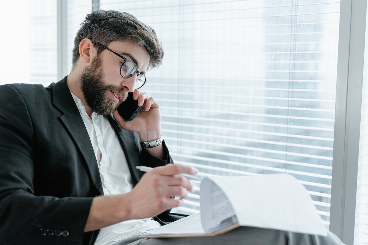 Agent reviewing his cold calling scripts for real estate lead generation