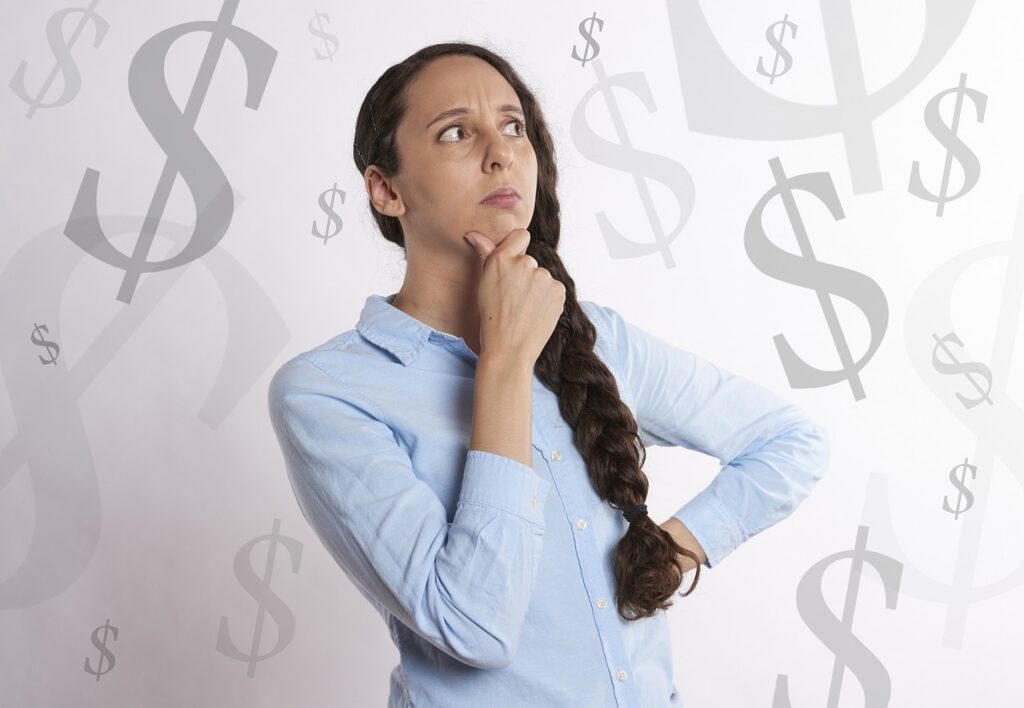 woman thinking, “Which is more profitable insurance or real estate