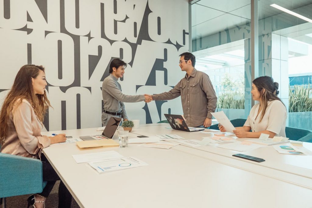 A Group of People Having a Meeting in the Office