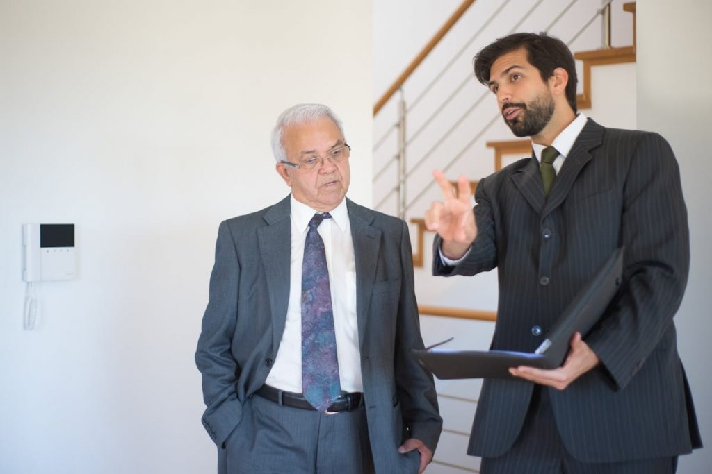 A Realtor Explaining to an Elderly Man