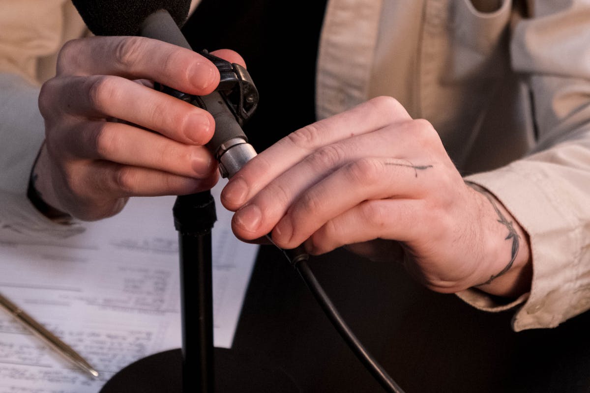 Photo of Man Holding a Microphone